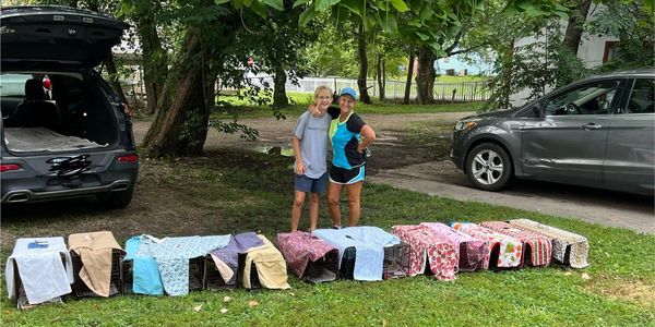 Volunteer trappers with cats in traps