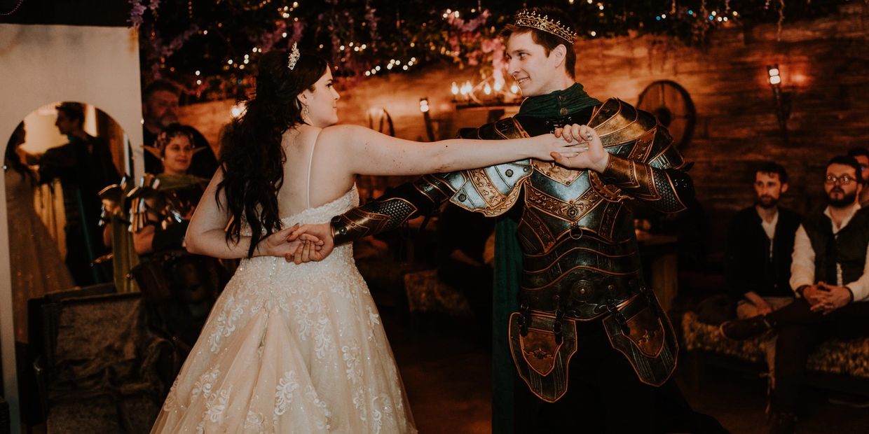 Gorgeous, medieval couple dances at Wisteria Castle.