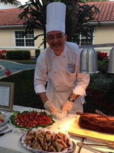 private chef in Jacksonville, FL - Walter is serving meal at private reception