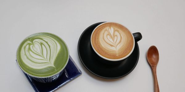 Matcha latte and classic latte in ceramic cups