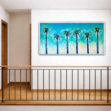 Modern interior with a vibrant palm tree painting on a white wall.