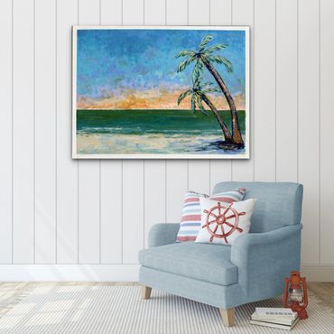 Cozy corner with ocean sunset painting and nautical-themed cushions.