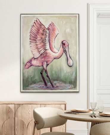 Painting of a pink bird with wings spread, hanging on a white wall.