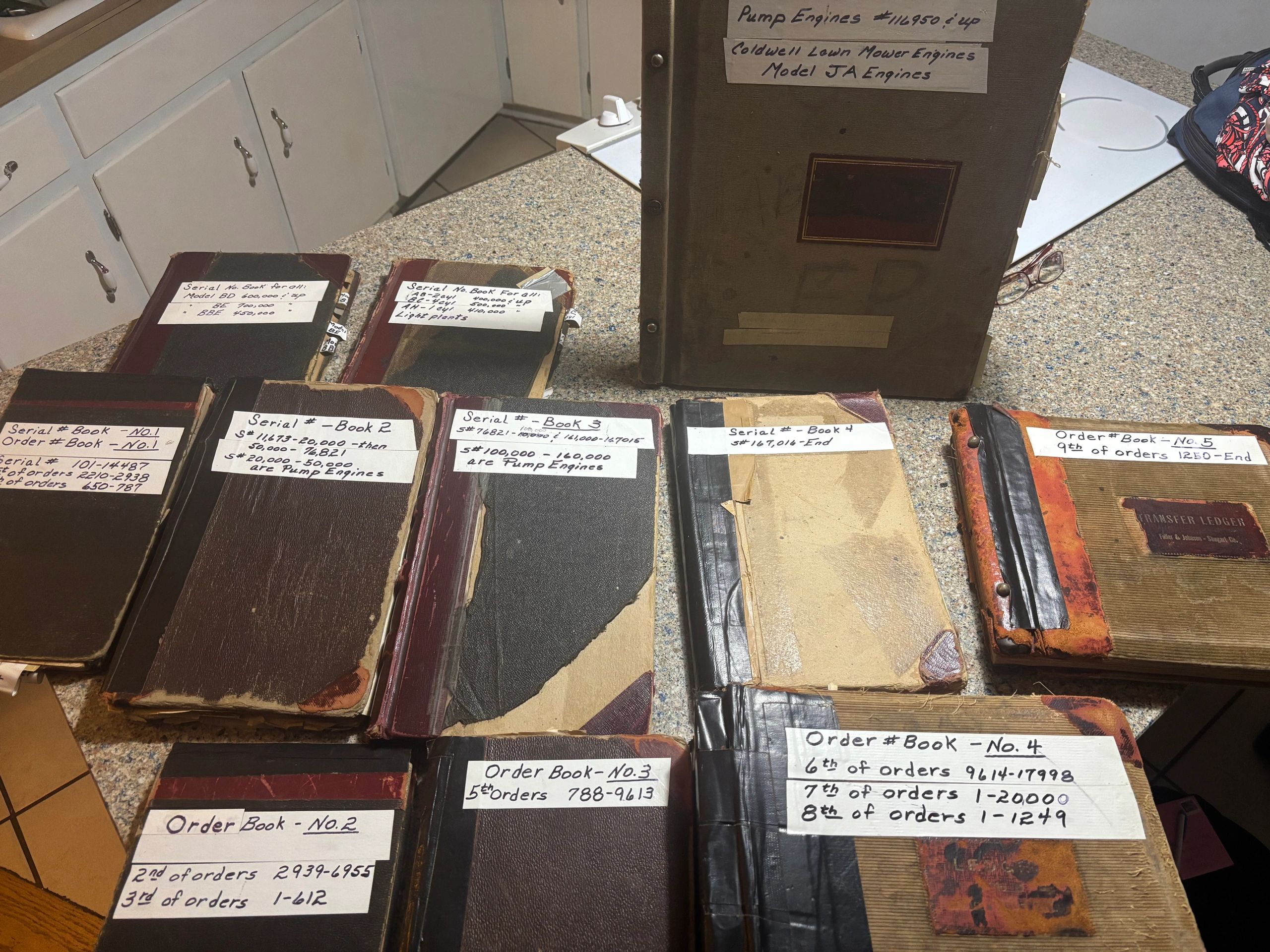 This photo depicts the original records from the Fuller And Johnson Company. 