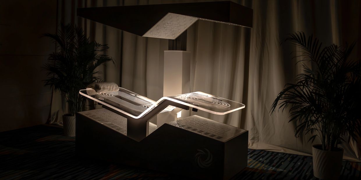 Futuristic illuminated lounge chair in a dimly lit room with plants.