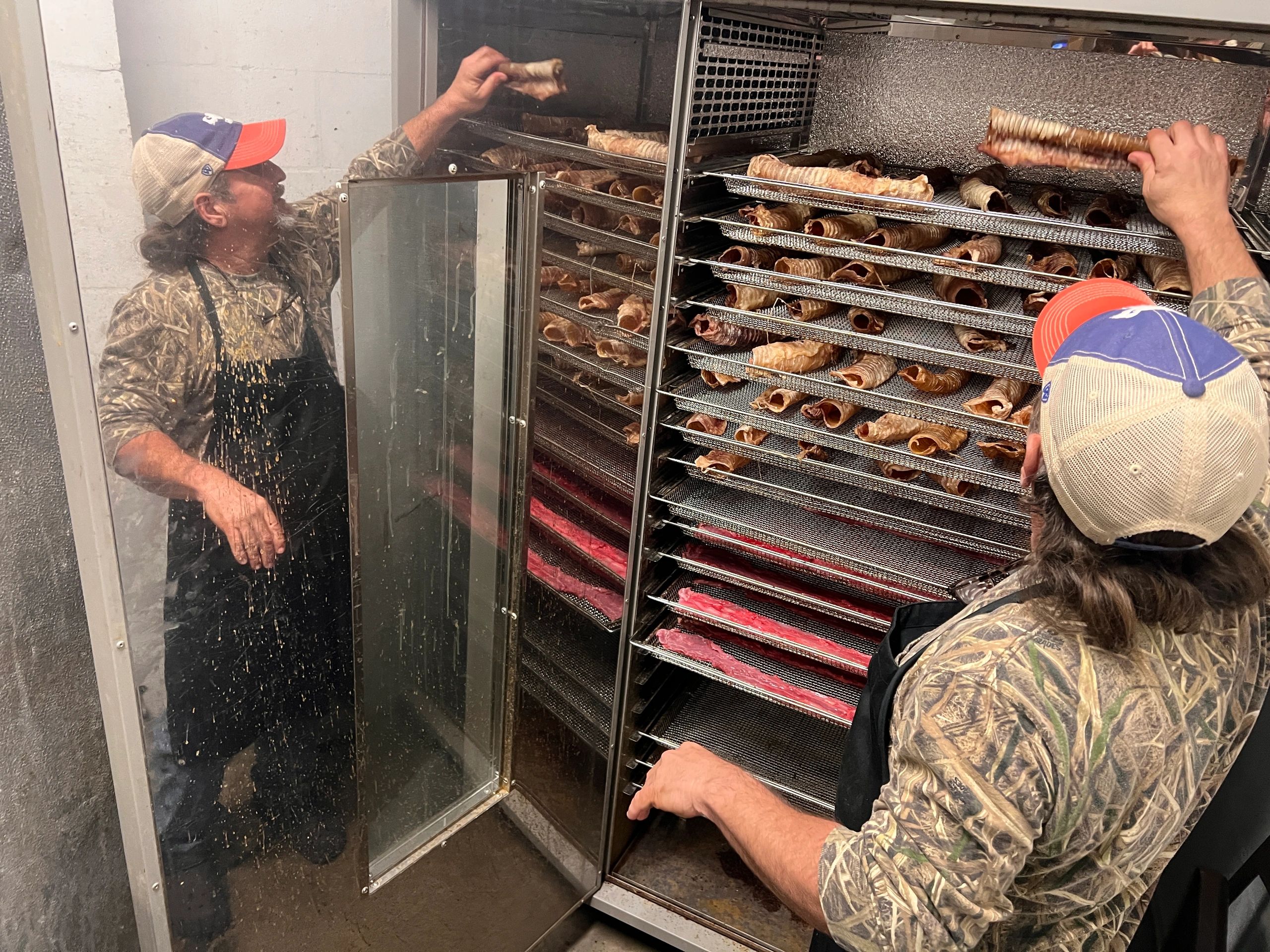 Owner Travis Simmons dehydrates beef tracheas and beef esophagus at Pupz Gourmet in Sebring.