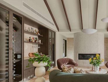 Cozy living room with modern fireplace and stylish furniture.