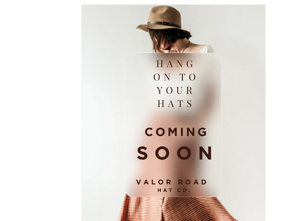 Woman wearing a hat with text overlay announcing Valor Road Hat Co.'s upcoming launch.