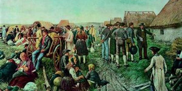 Historical scene of people gathered in traditional clothing near wagons and huts.
