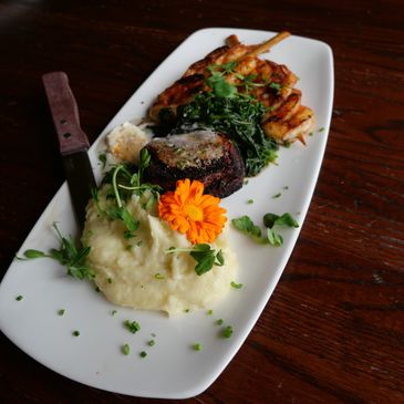 Oceans Edge steak and shrimp dish at Jackson House, featuring tequila butter, mashed potatoes, 