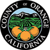 Seal of Orange County, California with mountains and oranges.