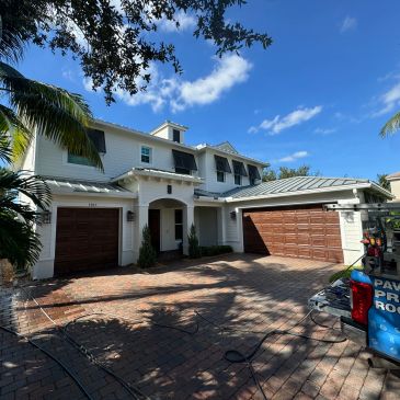 Soft wash roof cleaning removing black algae stains without walking on the roof
