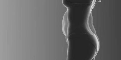 Silhouette of a pregnant woman in profile.