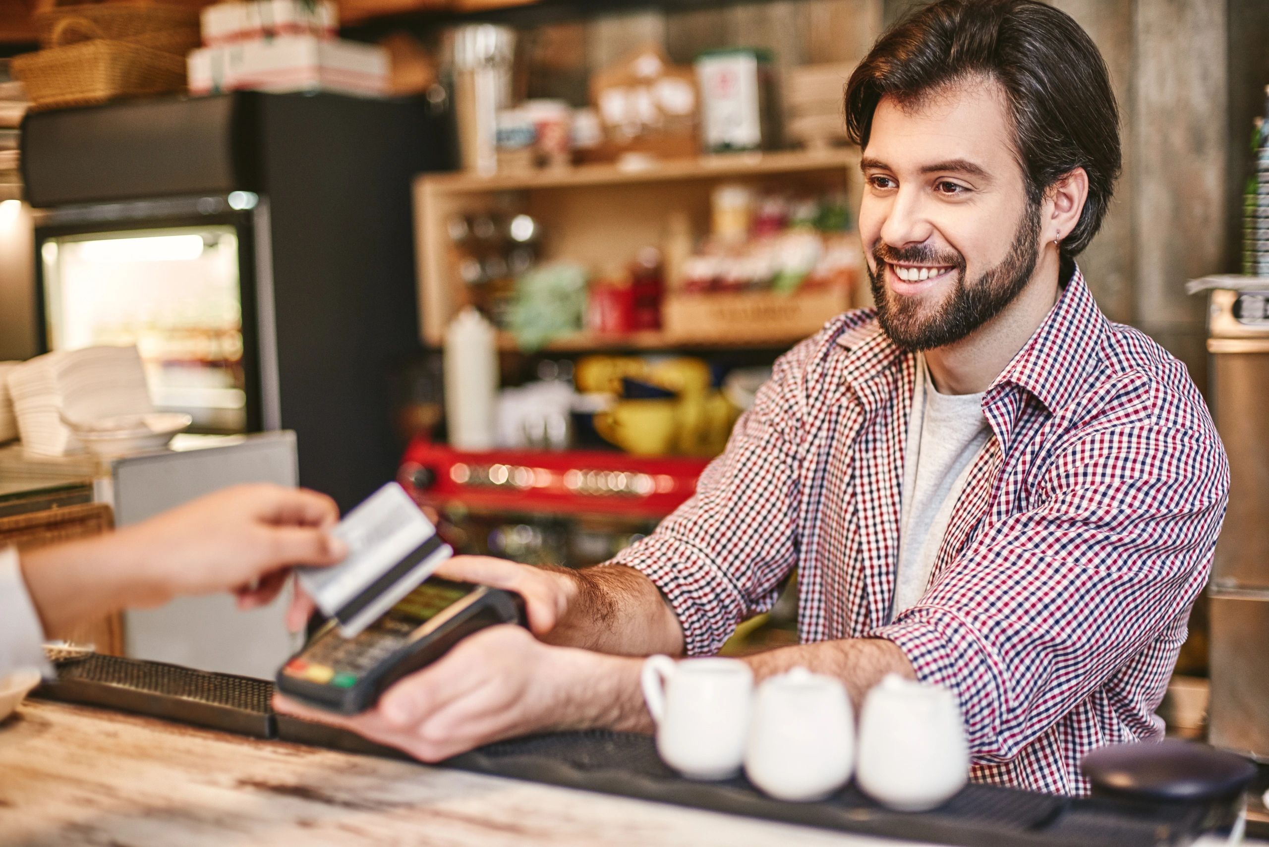 man happily selling to customer