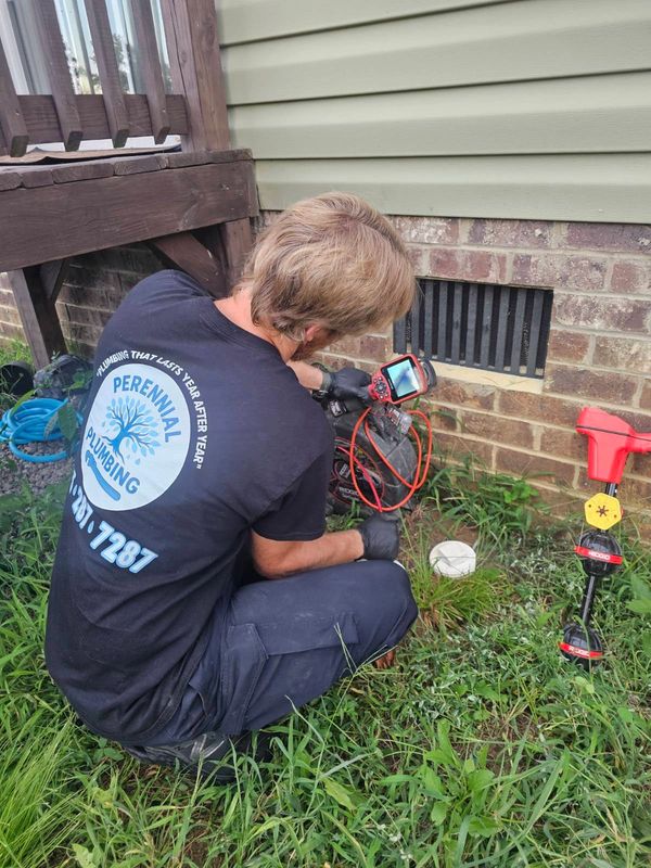 Running a camera inspection after unclogging a main sewer line for this homeowner!
