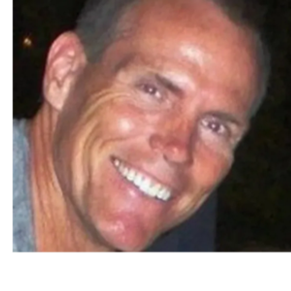 Close-up of a smiling man.