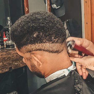 Man gets a razor cut.