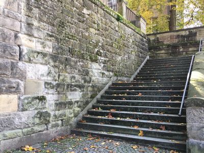 Stone stairs leading between street and plaza