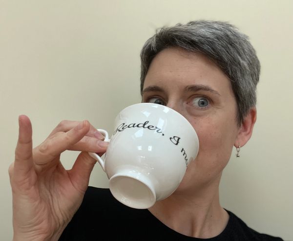 Kate is drinking a cup of tea