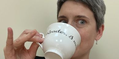 Kate is drinking from a teacup