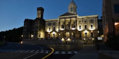 Illuminated historic building at night.