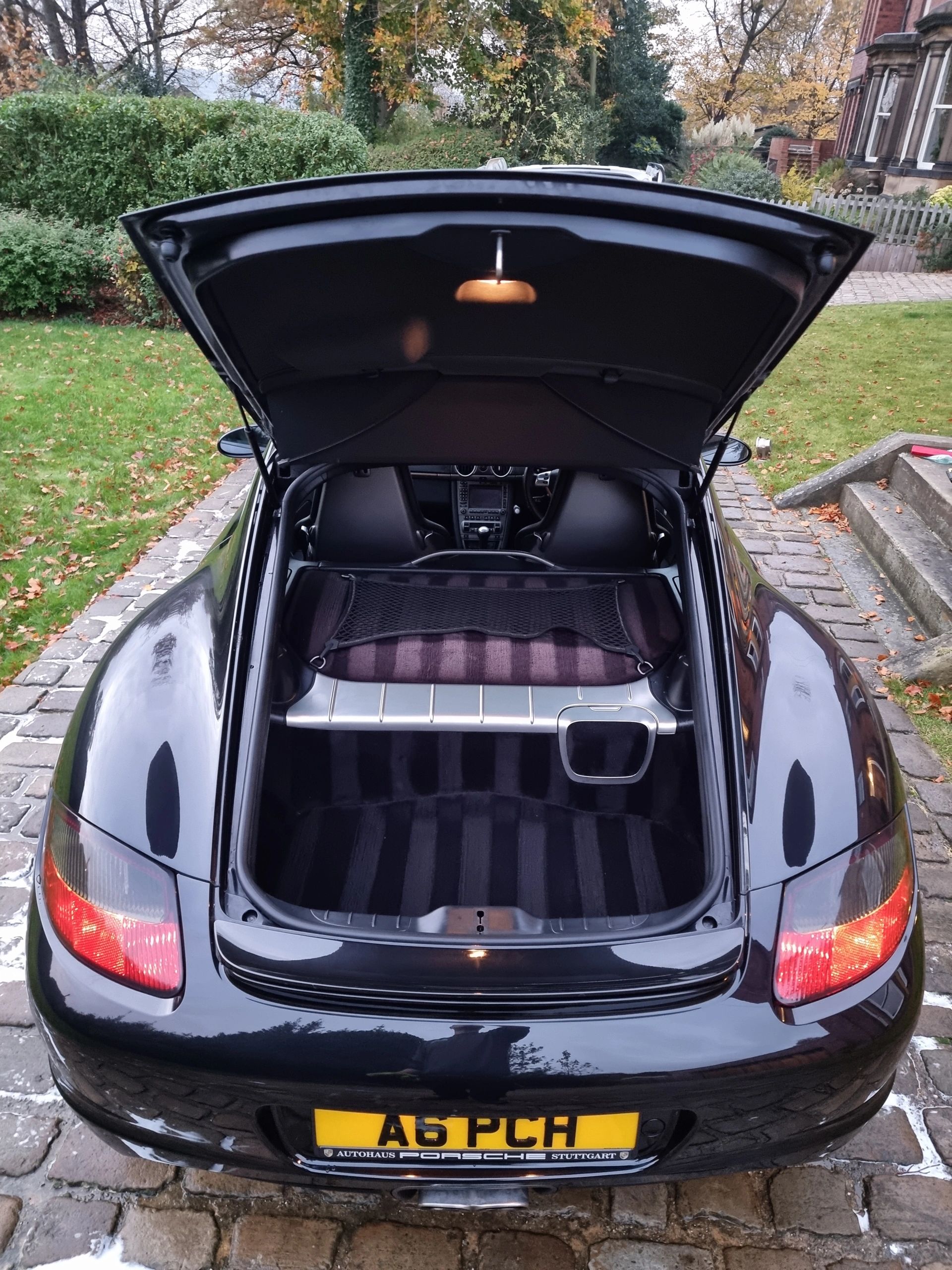 Porsche with an open boot and carpet striped after being valeted by Aztec Valeting
