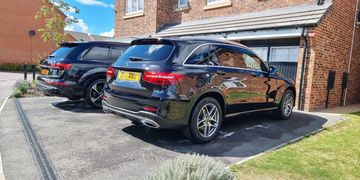 Two cars on a driveway in Wakefield after having Deep Clean Valets by Aztec Valeting