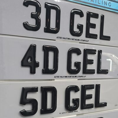 Various 3D, 4D, and 5D gel number plates displayed at Aztec Valeting & Detailing.