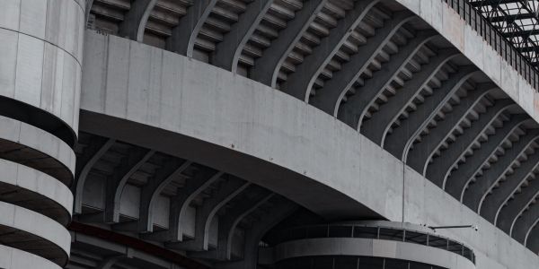 Concrete stadium architecture with curved beams.