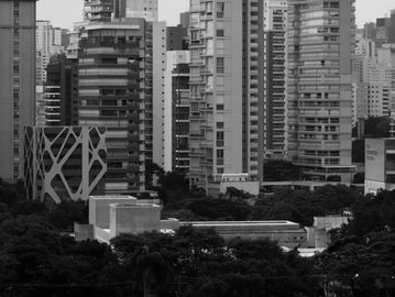 Black and white cityscape with various tall buildings.
