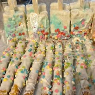 Colorful candy-coated chocolate sticks covered in white chocolate.