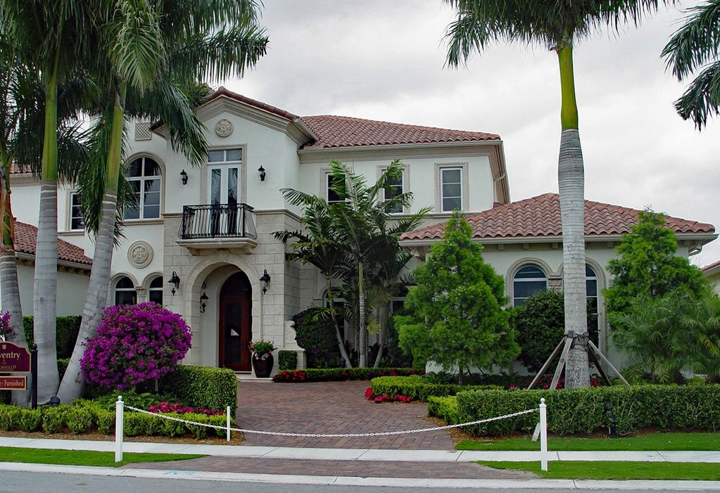 custom high-end residence, paver driveway, royal palms, tropical landscape