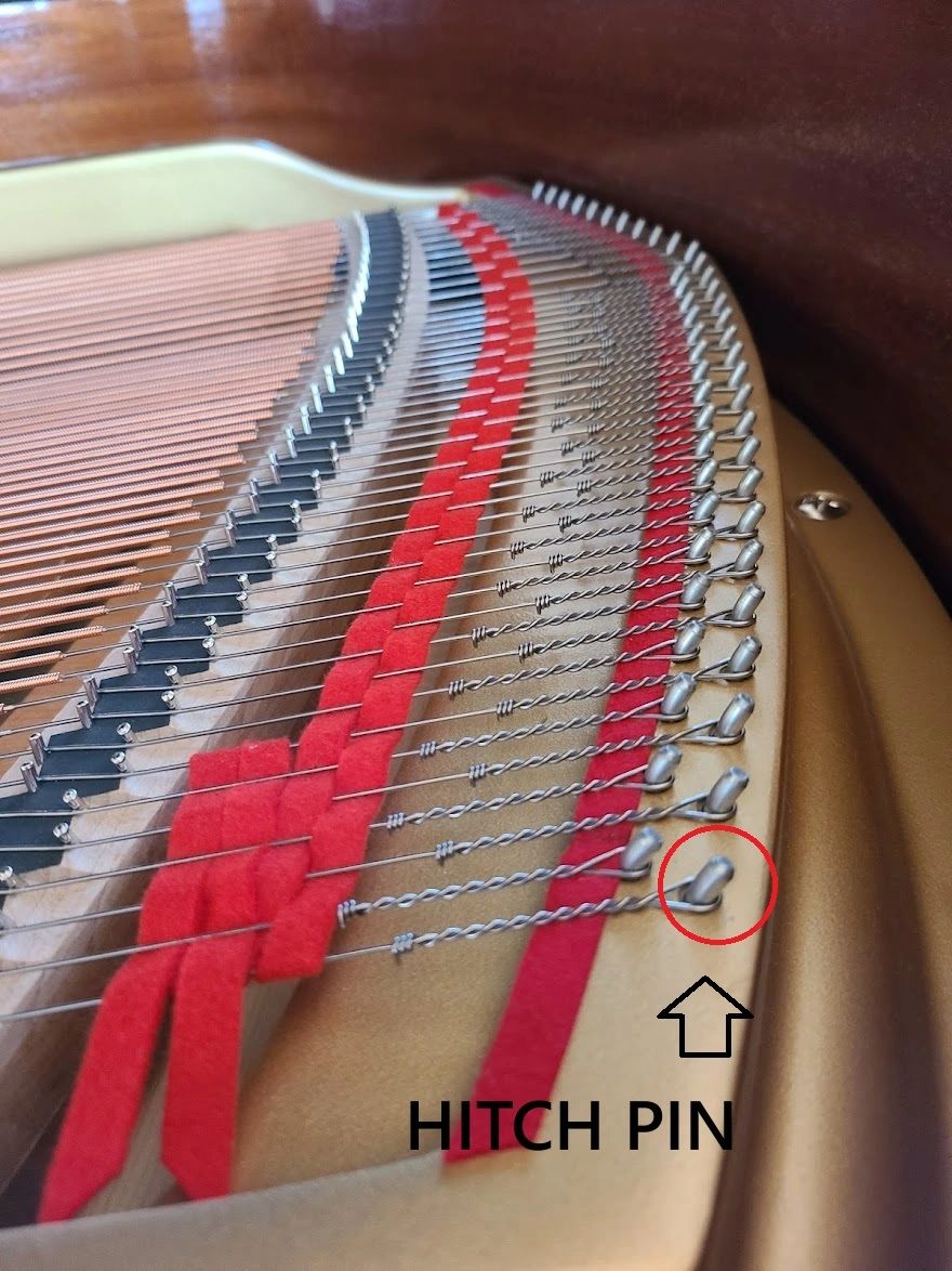 Hitch pin on a grand piano plate
