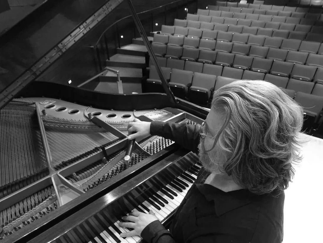 Joe Kemple (piano tuner) tuning a Steinway grand piano near St. Louis.