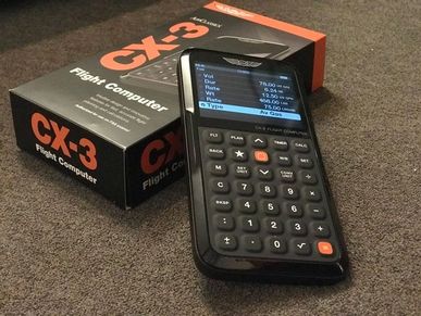 CX-3 Flight Computer with its box.