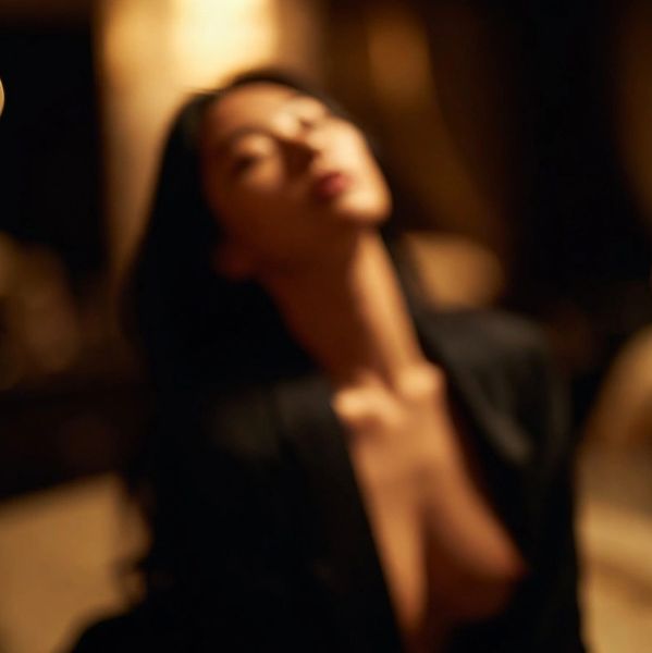Blurred artistic portrait of a woman.