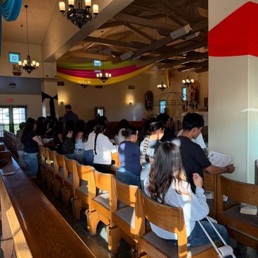 People seated in a church during a service or event.