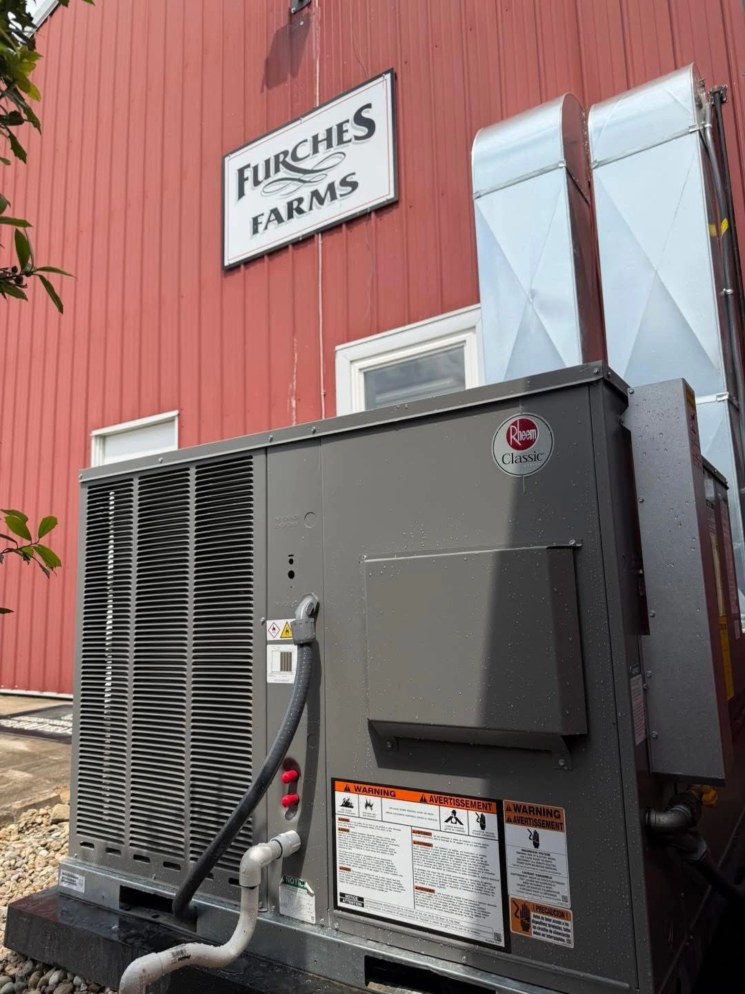 Rheem Classic HVAC unit outside Furches Farms building.