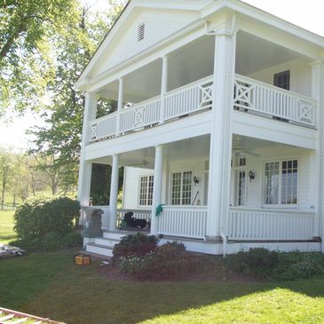 1900's Farmhouse. We restored 3 porches with Azek T&G decking. Replaced the roof  Restored chimneys.