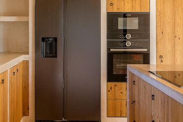 A kitchen where high-tech living meets the soul of Ibiza.