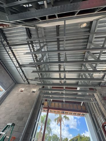 View of metal ceiling framework in a building under construction.