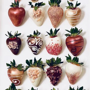 luxury gourmet chocolate covered strawberries in dark chocolate and white chocolate with designs