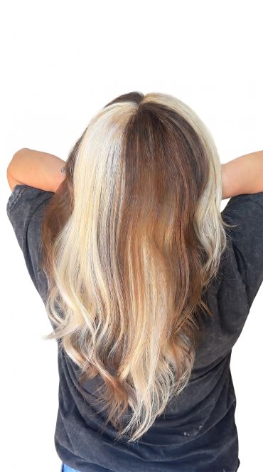 Person with half blonde, half brown hair.