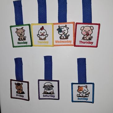 Cute cartoon animal clips for each day of the week with blue straps.