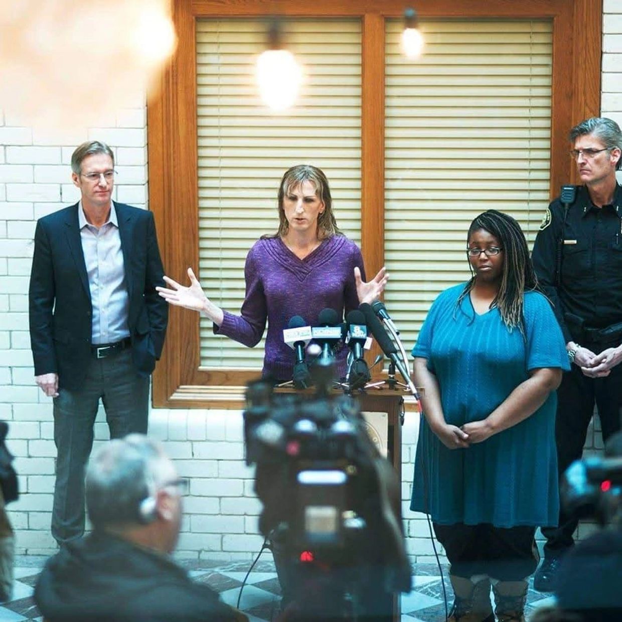 Rebekah Brewis leading a live news press meeting at Portland, Oregon City Hall January 2017