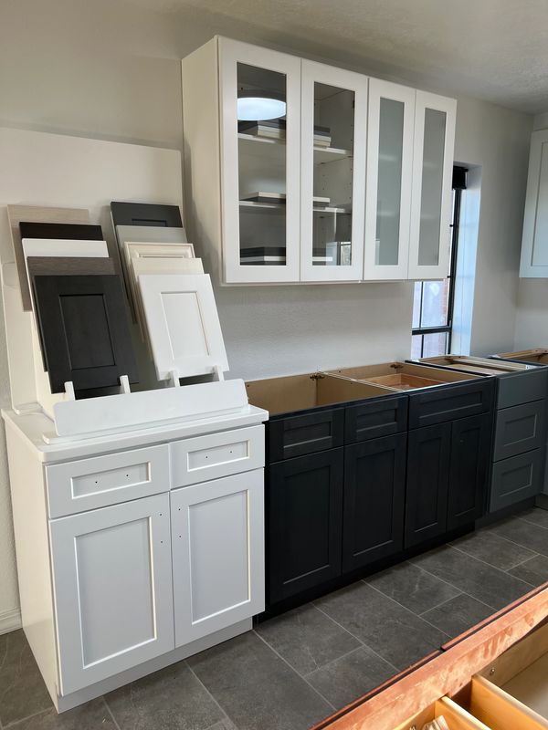 white and black cabinets in a kitchen 
