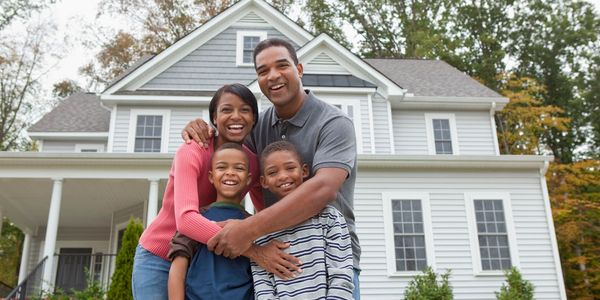 Family in front of home