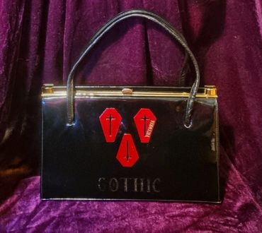 Black Patent Handbag with Red Coffins Design 