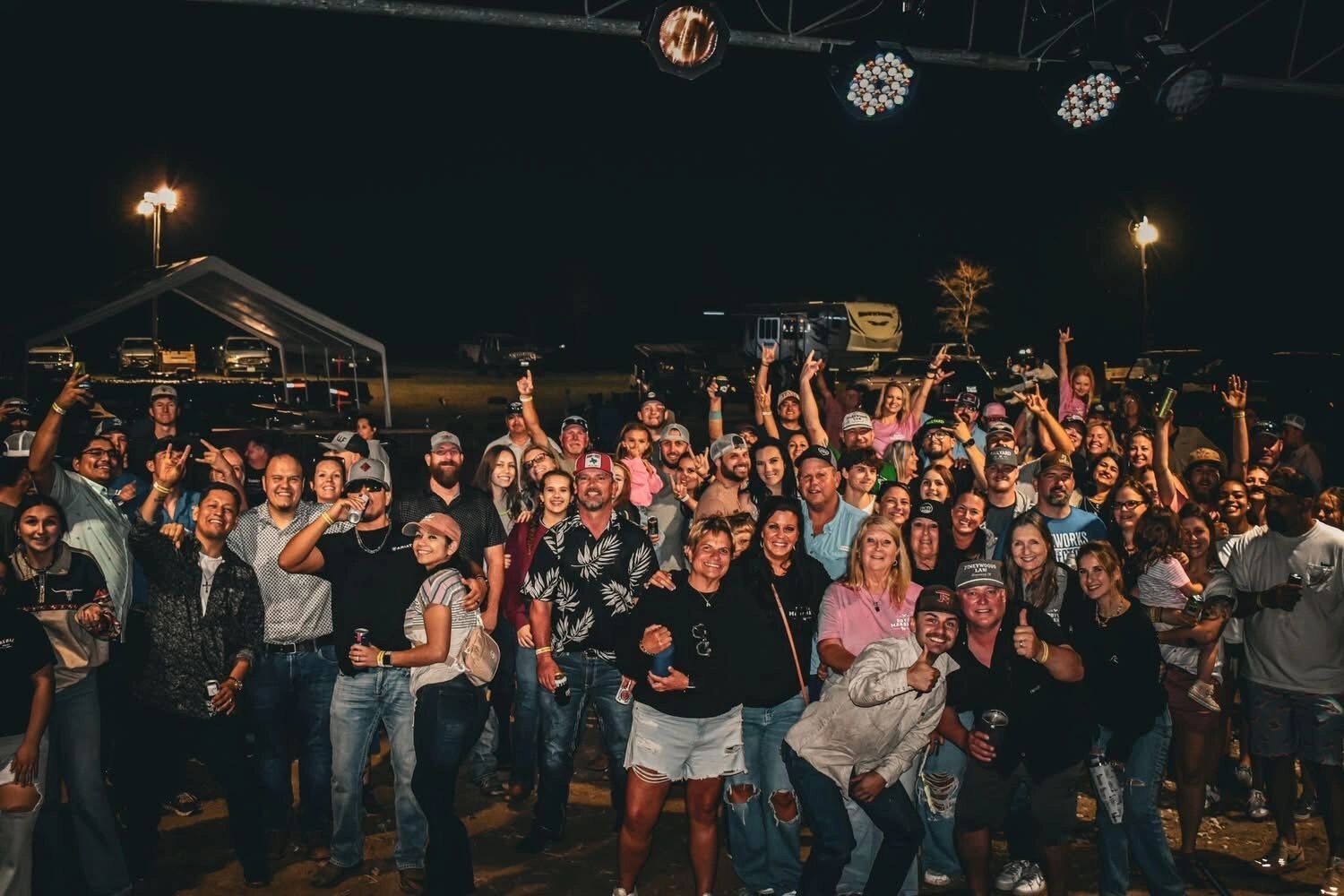 The crowd cheers in front of the stage at the Doyle Boil crawfish boil and concert in Slocum, Texas.