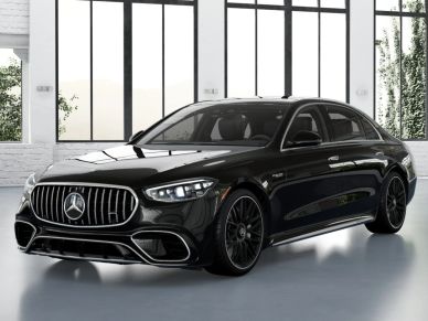 Black luxury Mercedes-Benz sedan in a modern showroom.